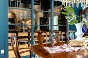 63 - Elegant Modern Wine Cellar with Blackout Window Beside a Dining Area in Atlanta