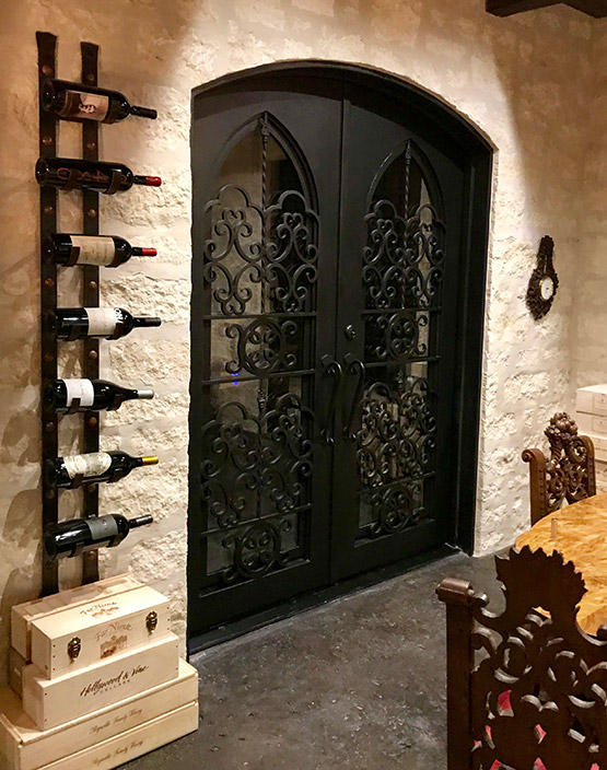 Wrought Iron Wine Cellar Door with Intricate Design